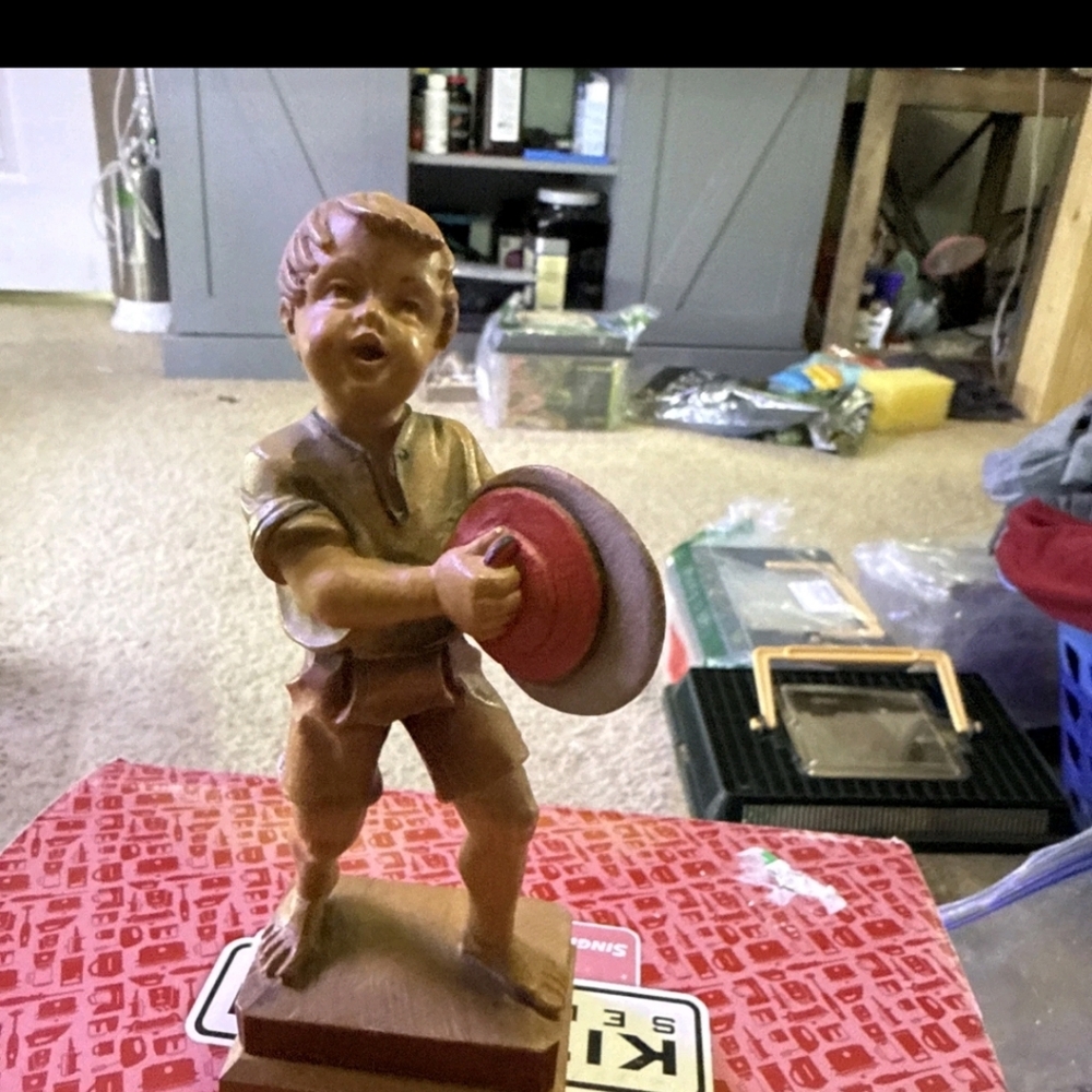 The ANRI Boy with cymbals figurine is a charming 6" handmade vintage piece